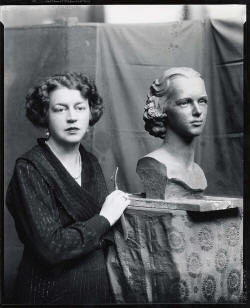 Margeret Cresson standing beside a bus of Nathalie Osborn.