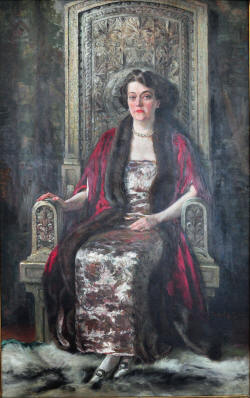Alma de Bretteville Spreckels painted in 1924 by artist Richard Hall. In the painting, Spreckels sits in a chair originally designed (and at least partly created) by Queen Marie of Romania as an audience chair for herself. Spreckels obtained the chair in 1922 for an exhibition at the California Palace of the Legion of Honor; she eventually donated both the chair and the painting to the Maryhill Museum of Art, which she played a major role in founding.