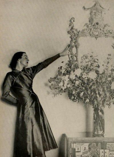 "Don Loper's version of the the increasingly important costume dress... a Regency breakaway coat with separate skirt, in pure silk serge; iridescent black rose or black pearl." The Californian, August 1948
