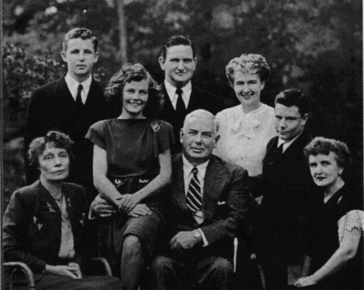 The Marston clan: Elizabeth is far left, Olive far right, the three boys are their sons, the girl on his right is his daughter, and the woman on his left is Margaret Huntley.