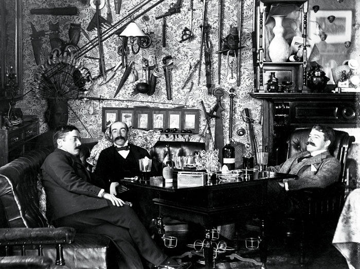 Trappings of privilege: Alexander Turnbull, far right, relaxing in the billiard room at the family home with brother Robert, left, and lawyer EF Hadfield. Photo/Alexander Turnbull Library
