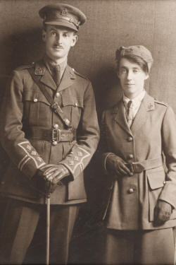 Three quarter length studio portrait of Lieutenant (Dr) Vera Scantlebury and her brother Captain George Clifford Scantlebury dressed in WWI military uniforms.