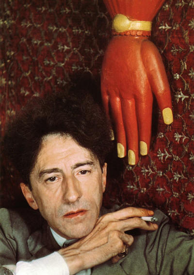 Jean Cocteau, with red hand, Paris, 1939 © Gisèle Freund