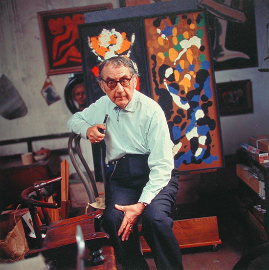 Man Ray, a pipe in his hand, in his studio, Paris, 1967 © Gisèle Freund