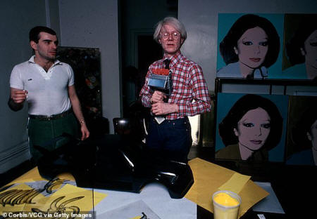 Warhol's first proper lover, to whom he appears to have lost his virginity to, was a 20-year-old called Carlton Alfred Willers, who Warhol called' Willers'. Willers was a clerk at the picture collection of the New York Public Library and Gopnik writes the two men were 'intimate'. But Warhol was 'lousy in bed' as Willers described it, a description Warhol would be given by lovers 'for the rest of his life'. Pictured: Warhol at his art studio